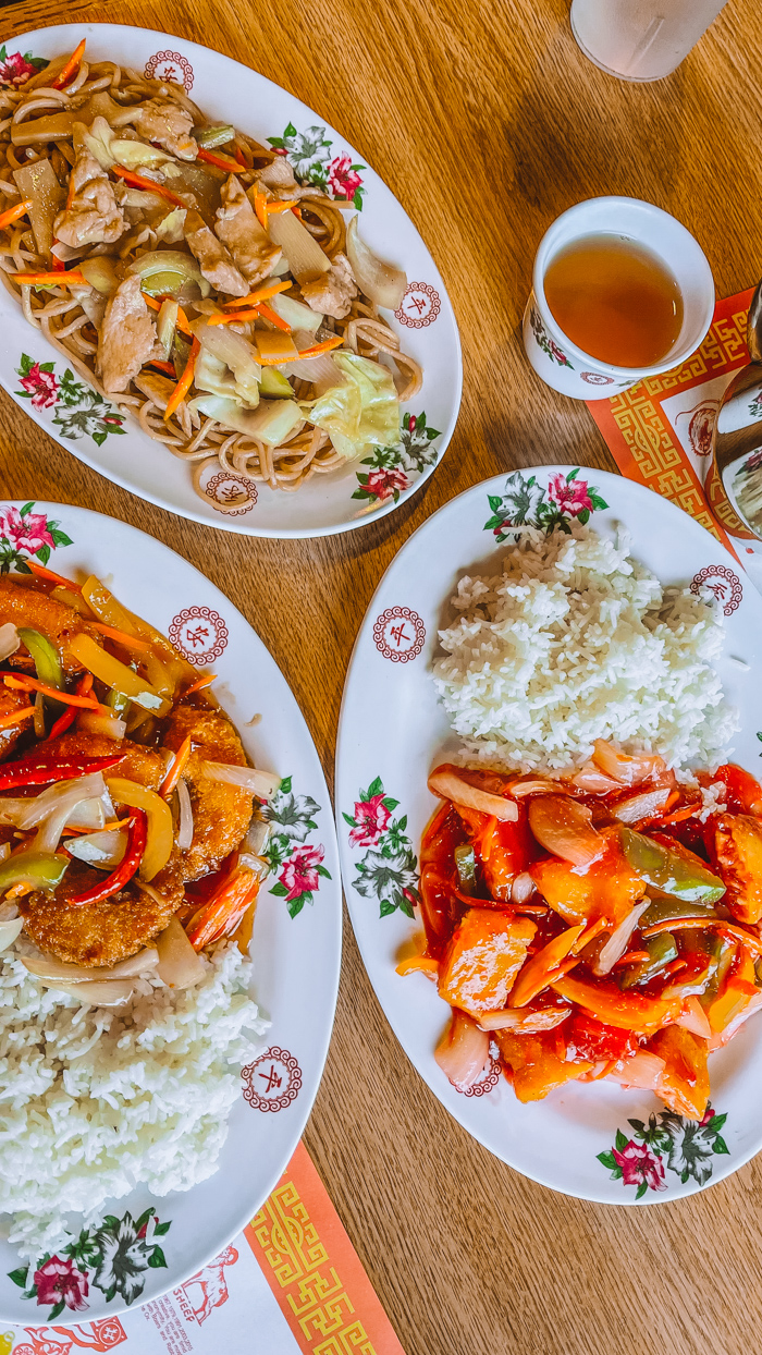 Joan Mei serving Asian dishes in town